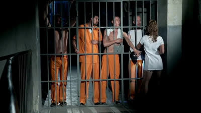 Naughty policewoman has an orgy with the inmates in the prison